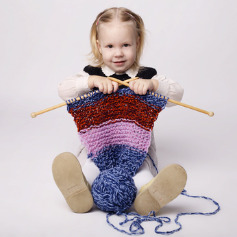 little girl knitting