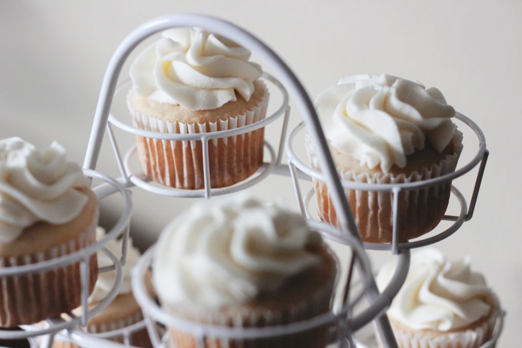 White cupcakes on a stand