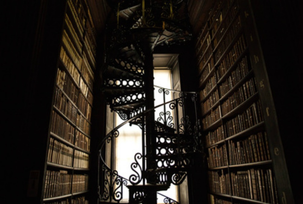 My favorite books of all time surrounded by an ornate spiral staircase