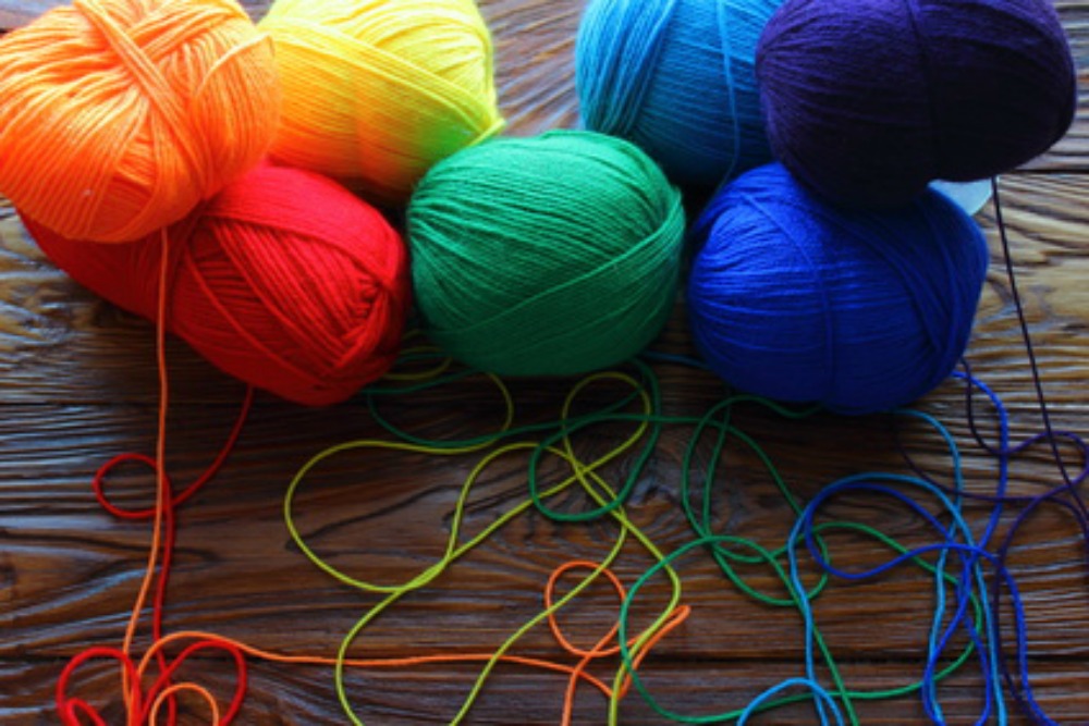 Balls of colorful yarn you can use to knit to make a lasting impression