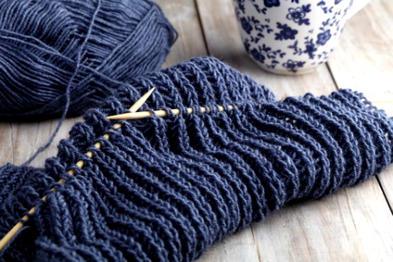 Beautiful blue yarn on knitting needles. Perfect for hitching your star to the new future.